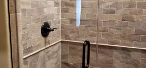 Stone shower with glass walls